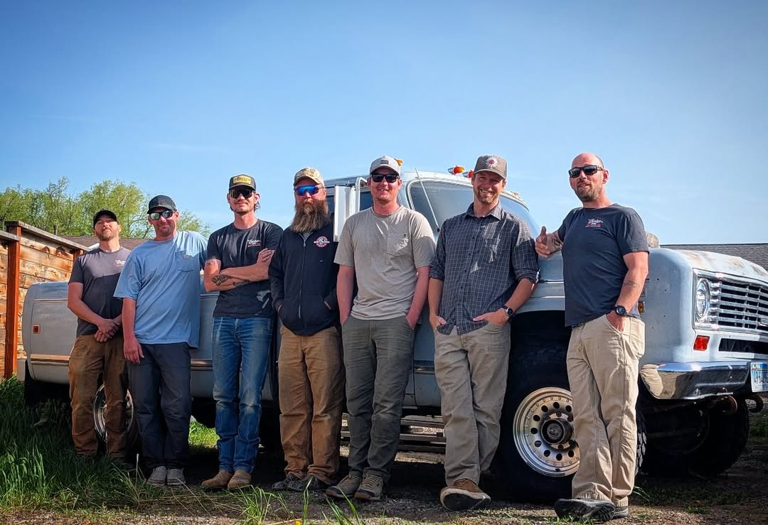 The Boise Bros crew lined up in front of a classic pickup