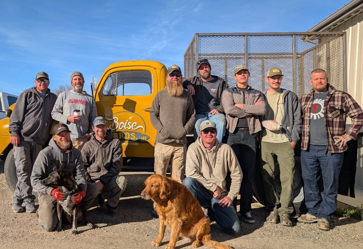 The Boise Bros crew with their vintage yellow company truck